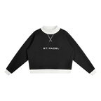 St. Padel Mock Neck Pullover. A black long-sleeve cropped sweatshirt with a white ribbed crew neck, cuffs, and hem, featuring 'ST PADEL' printed in white arched block letters across the chest.