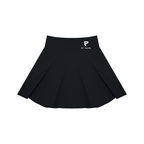St. Padel Women's Pleated Padel Skirt. A black pleated skater skirt with a small white embroidered logo on the left hip, displayed against a solid white background.