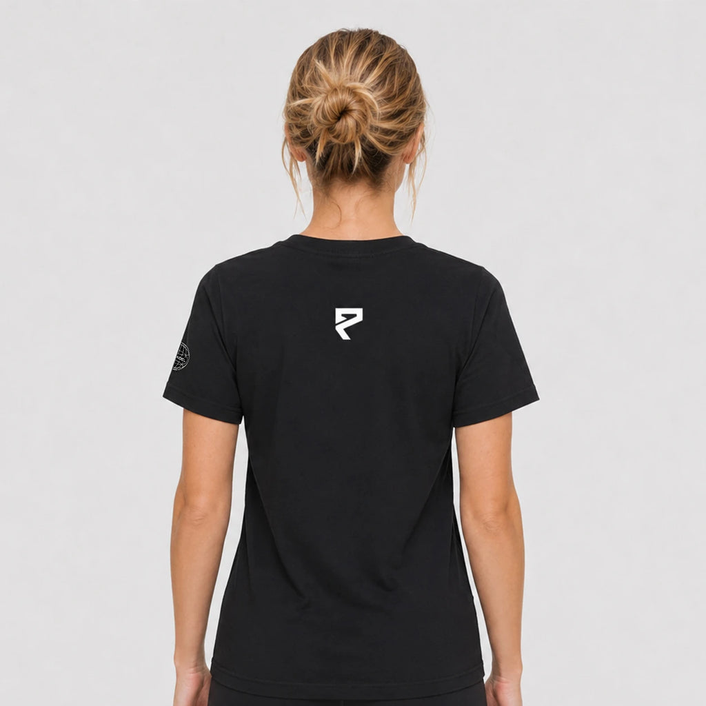 St. Padel Lifestyle Cotton T-Shirt. A woman viewed from the back wearing a black short-sleeve t-shirt with a small white stylized ST PADEL logo centered on the upper back, against a light gray studio background.