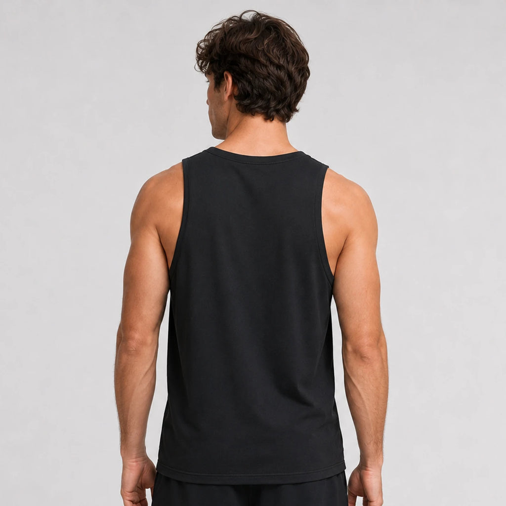 St_Padel Men's Performance Tank Top. A man viewed from behind wearing a black sleeveless tank top against a light gray studio background.