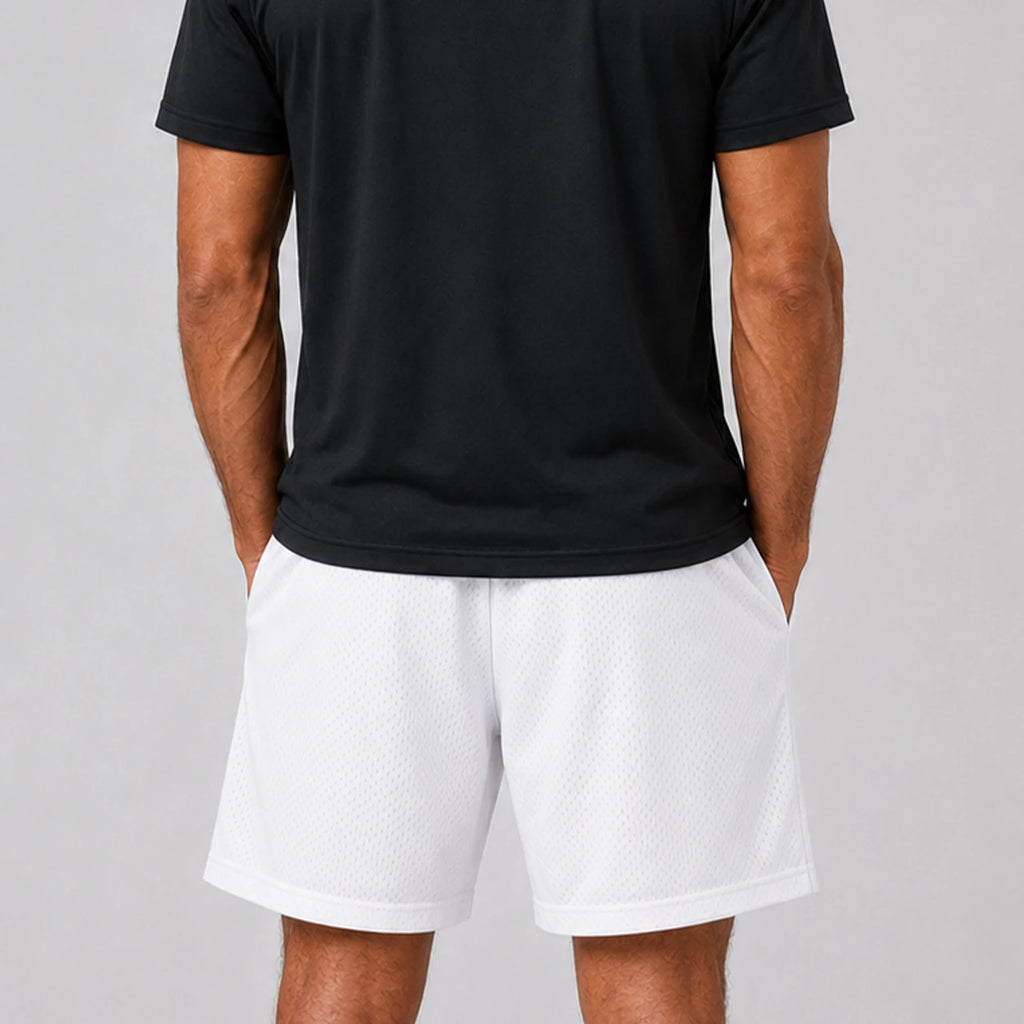 ST Padel Mesh Drawstring Shorts. A man wearing white athletic mesh shorts and a black t-shirt, shown from the back against a light gray studio background.